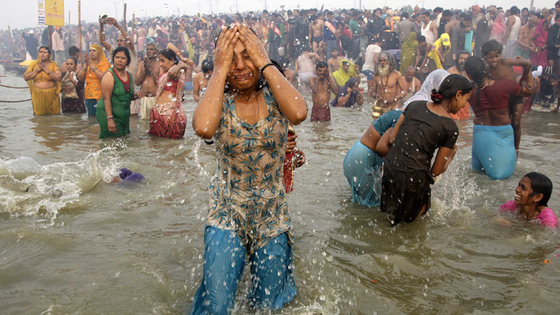 Hindu devotees take dip during first "Shahi Snan" at ongoing "Kumbh Mela", or Pitcher Festival, in the northern Indian city of Allahabad