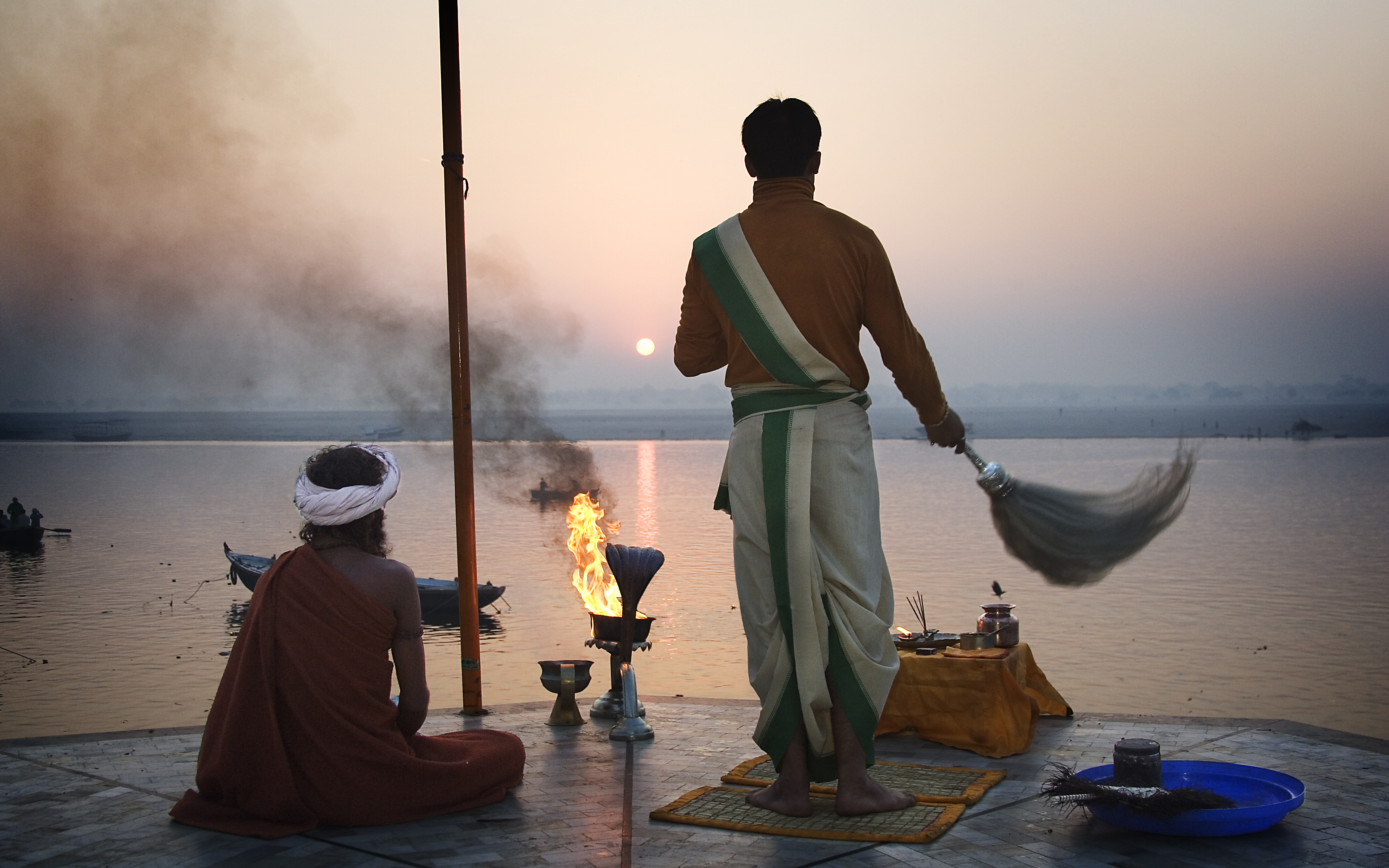 Priest saluting the sun in the Ganges, Varanasi Benares India